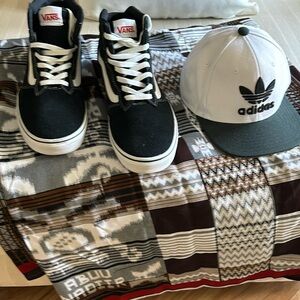 I am selling a pair of Black and White Vans men sneakers size 11 adida hat 40.00